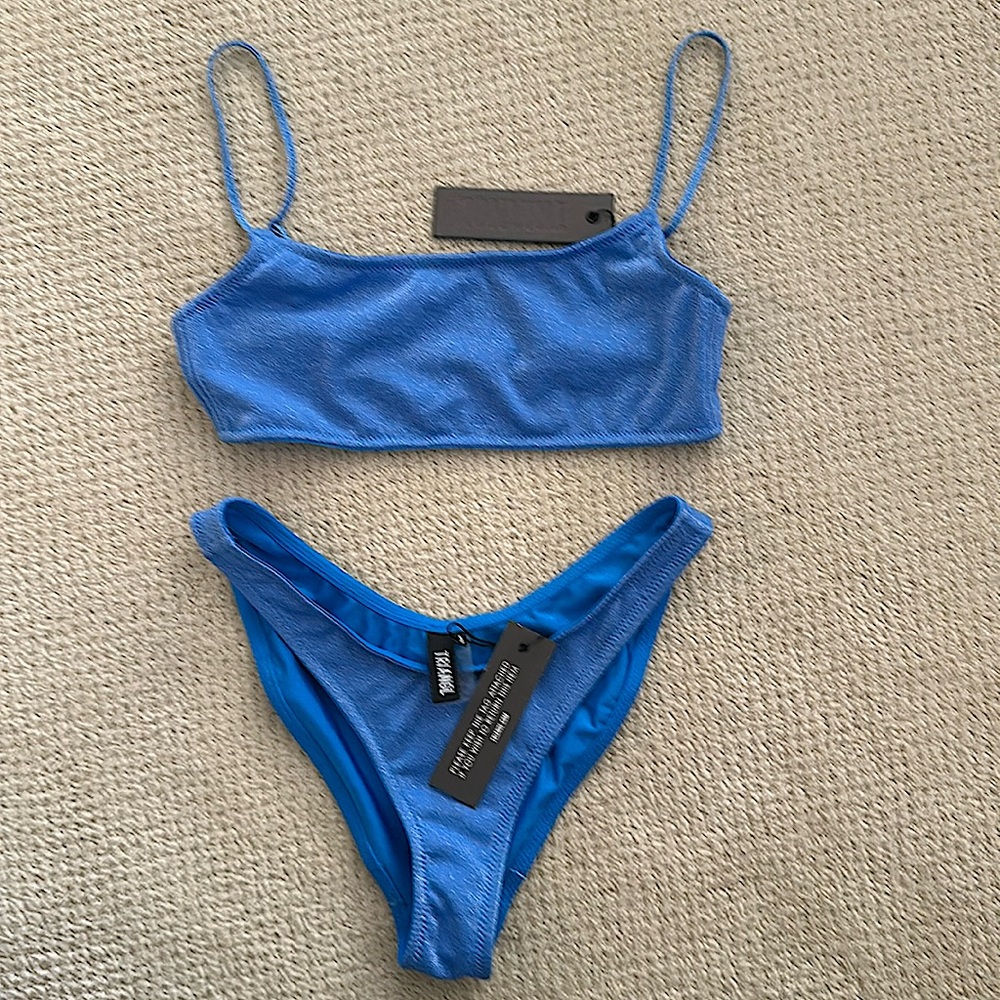 TRIANGL blue swimsuit size small top medium bottom. Never worn, tags attached